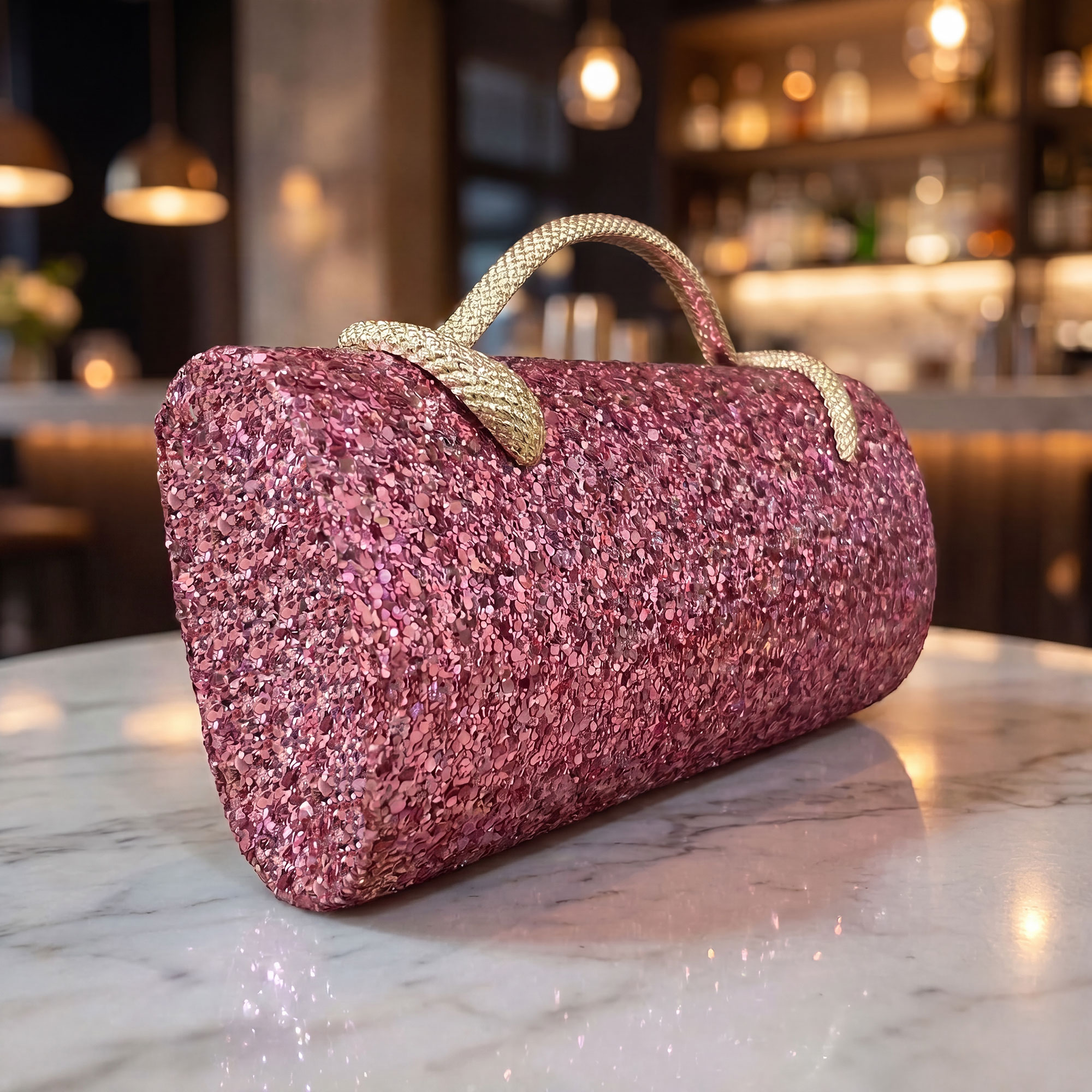 Verano Hill glitter clutch styled on a marble bar counter — in-situ lifestyle